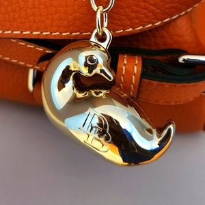 Dooney and Bourke Duck Gold Super rare and brand new